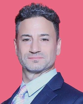 Portrait of a handsome stylish man in a suit and tie looking smart but inviting.